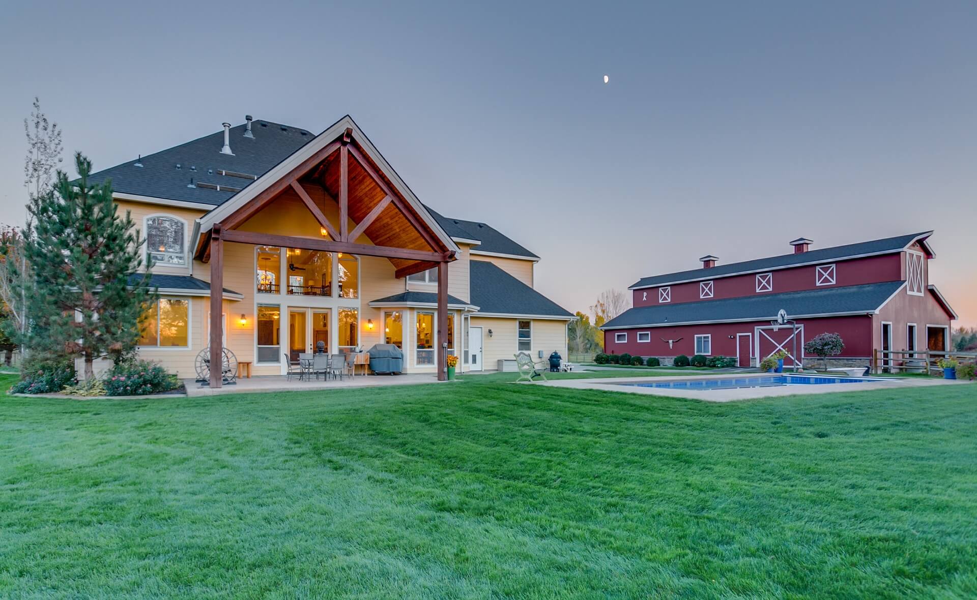 Luxury home by Boise river with massive red barn and in ground pool