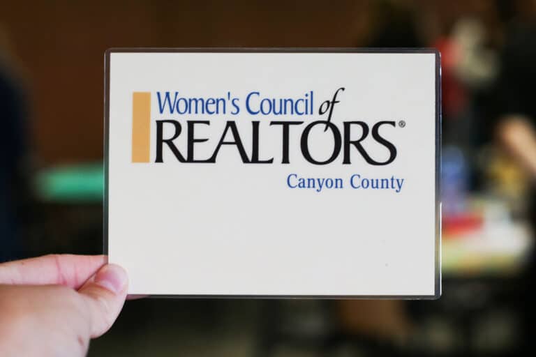 Women's Council of Realtors card held up with blurry background.jpg (1)