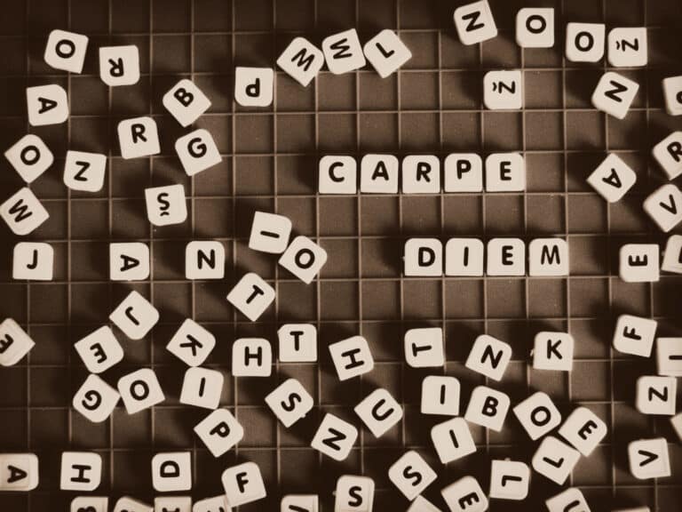 scrabble on a grid spelling out carpe diem at a game cafe